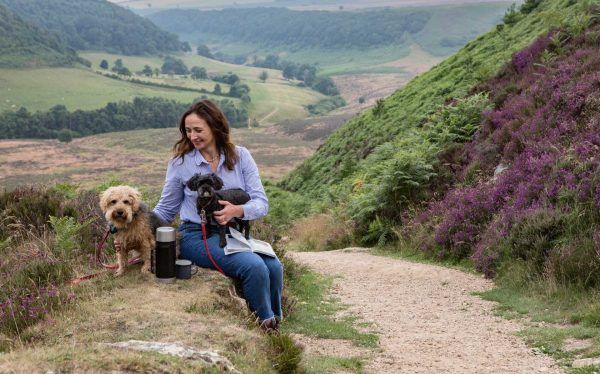 Dog walker with dog at Hole of Horcum_lpr - Credit Polly A Baldwin